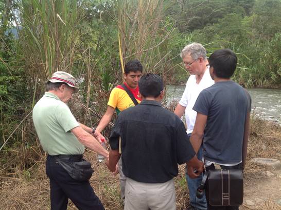 Abide in Christ Ecuadorian team praying for outreach among Shuar.