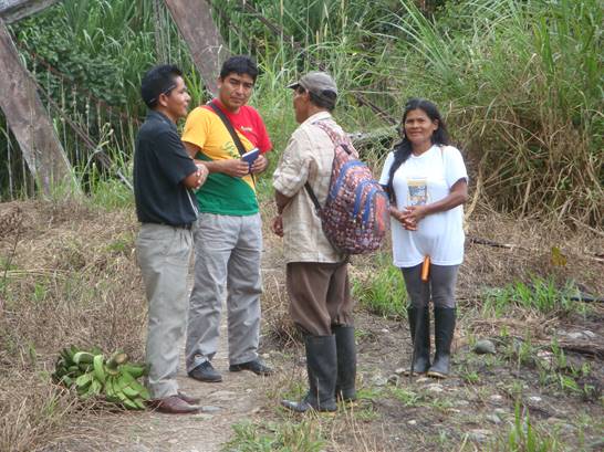 Abide in Christ team witnessing to Shuar couple in Ecuador.