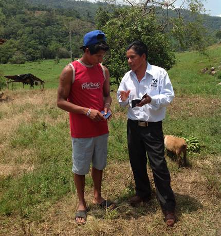 Abide in Christ team member Alejandro witnessing to Shauar man in jungle.