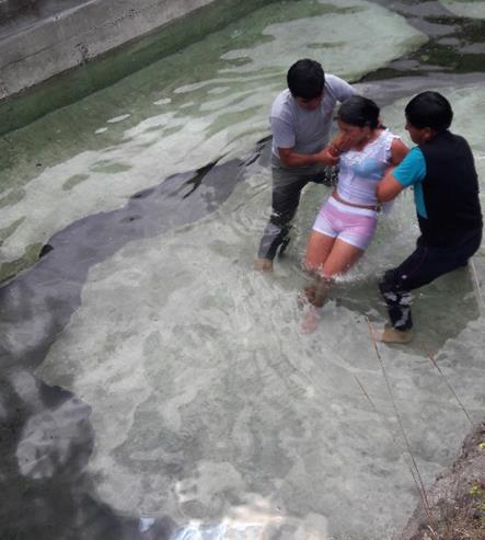 Baptism of new believers in Ecuador.
