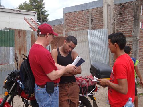 Door to door witnessing at Abide in Christ evangelism conference.