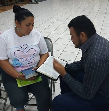 Participants practicing personal evangelism at Abide in Christ workshop.