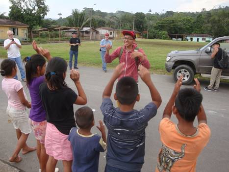 Ecuadorian Shuar children playing games with Abide in Christ evangelism team.