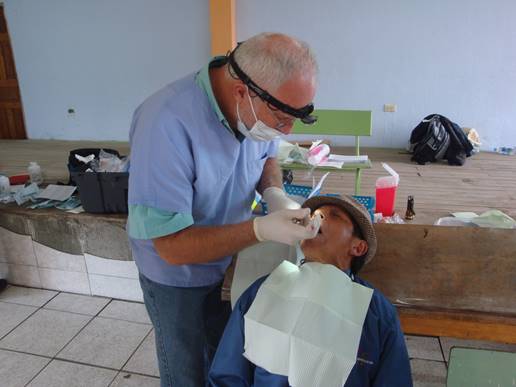 Sharing the gospel of Jesus Christ with dental patient.