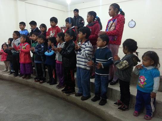 Children singing at Pintag, Ecuador evangelical worship service.