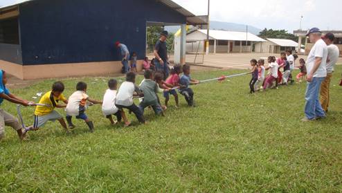 Shuar children enjoying game of tub of war with Abide in Christ team.